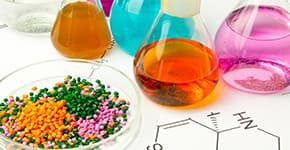 Bottles of chemicals and plastic pellets illustrates PlusChem's expertise in Additives